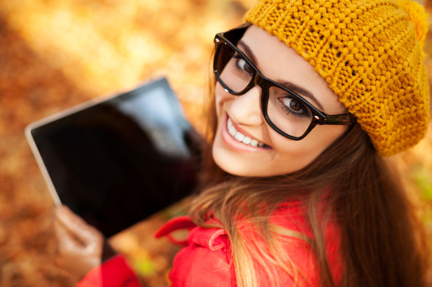 High school girl smiles with tablet